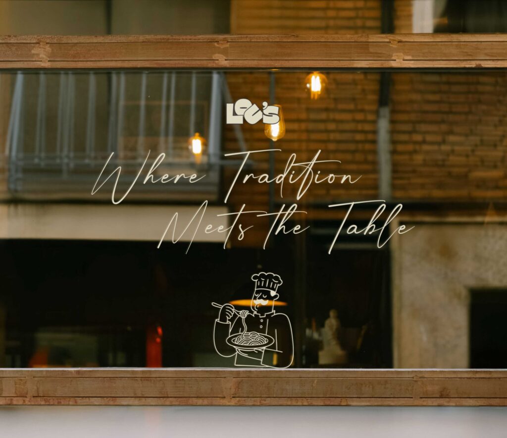 Lou's custom window decal on the restaurant shopfront glass